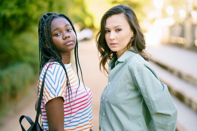 Portrait of young women standing outdoors