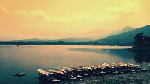 Scenic view of river against sky during sunset