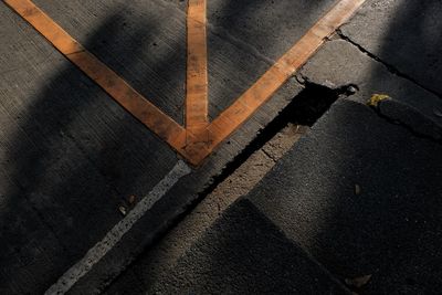 High angle view of road sign on street