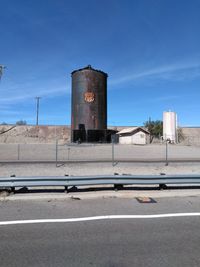 View of factory against blue sky