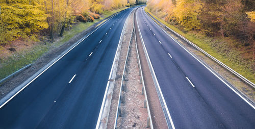 View of highway through autumn trees