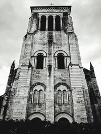 Low angle view of bell tower against sky