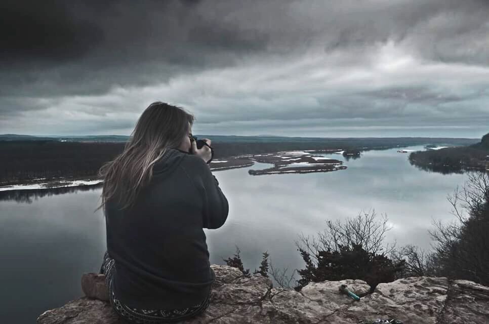 WOMAN LOOKING AT SEA SHORE