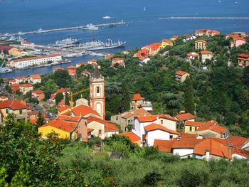 High angle view of townscape by sea