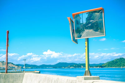 Scenic view of sea against blue sky