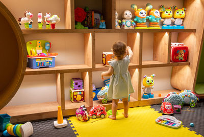 High angle view of boy playing with toys