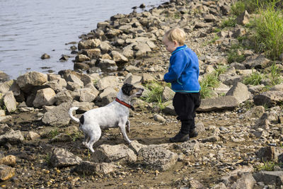 Full length of a dog and toddler