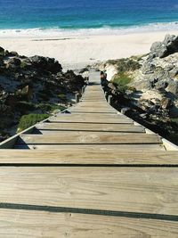 High angle view of walkway leading towards sea