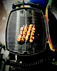 Close-up of meat on barbecue grill