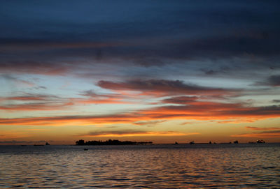 Scenic view of sea at sunset