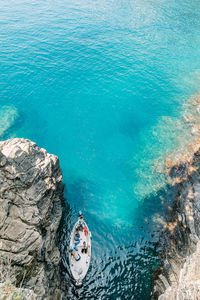 High angle view of rocks in sea