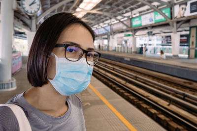 Portrait of woman at railroad station