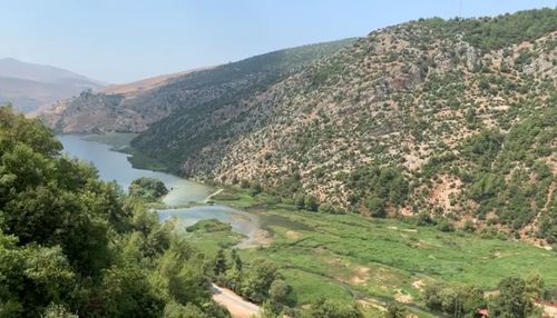 Scenic view of landscape and mountains against sky