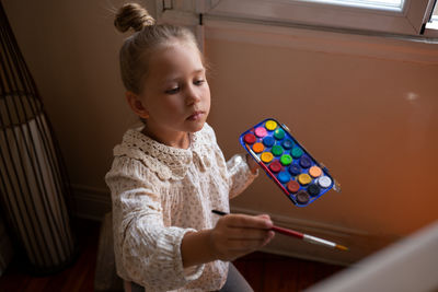 Portrait of young woman using mobile phone