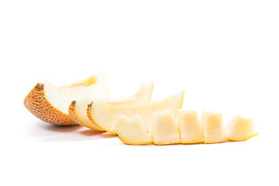 Close-up of bananas against white background