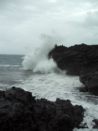 Waves splashing on rocks