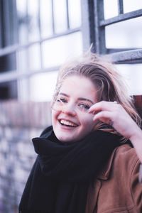 Portrait of a smiling young woman in winter