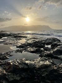 Scenic view of sea against sky during sunset