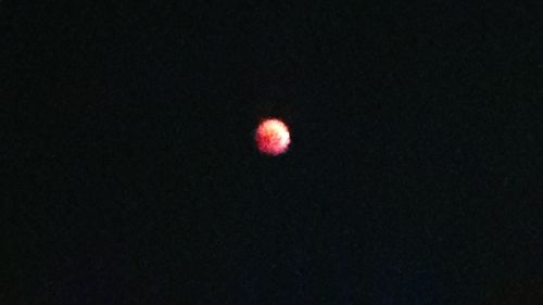 Low angle view of moon against sky at night