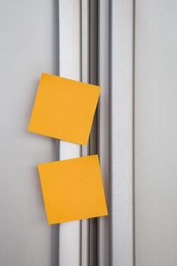 Close-up of blank adhesive notes on refrigerator