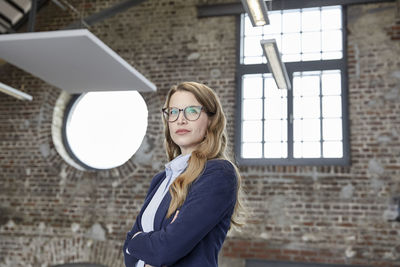 Portrait of confident businesswoman in a loft