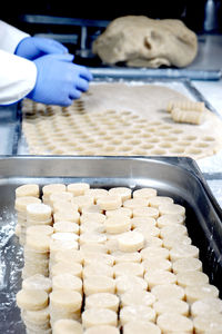 Worker is preparing almond sweet at chocolate factory