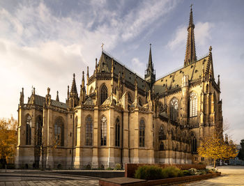 Low angle view of new cathedral against cloudy sky