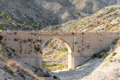 Arch bridge over river