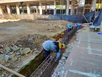 High angle view of man working in canal