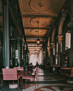 People sitting in corridor of building