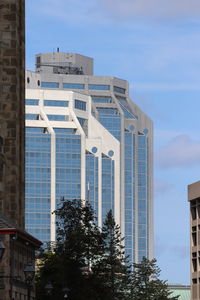 Low angle view of modern building against sky