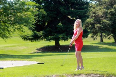 Full length of a person standing on golf course