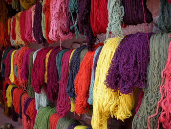 Full frame shot of multi colored umbrellas hanging at market stall