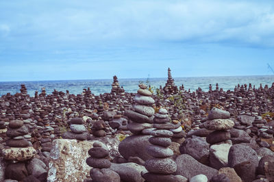 Stack of pebbles against calm sea