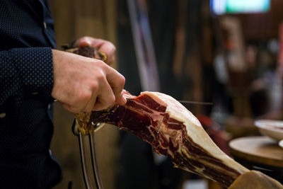 Midsection of man preparing food