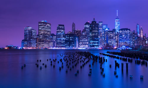 Illuminated city at waterfront