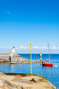 Scenic view of sea against blue sky