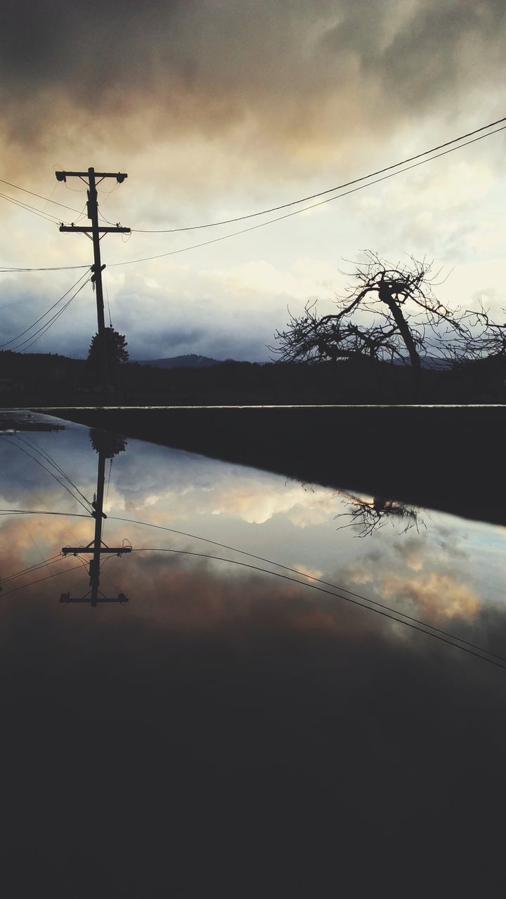 sky, reflection, cloud - sky, silhouette, water, sunset, cable, beauty in nature, nature, lake, no people, power line, waterfront, tranquility, electricity, technology, tree, electricity pylon, tranquil scene, outdoors, power supply