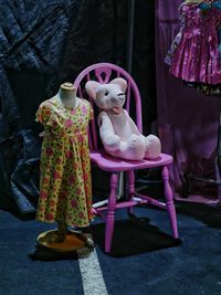 View of pink toys on chair