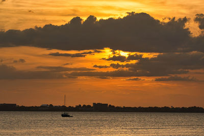 Scenic view of sea against orange sky