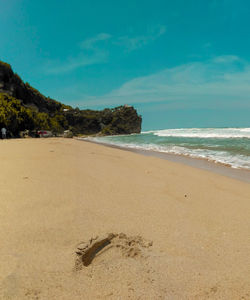 Scenic view of beach against sky