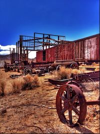 Old ruin on field against blue sky