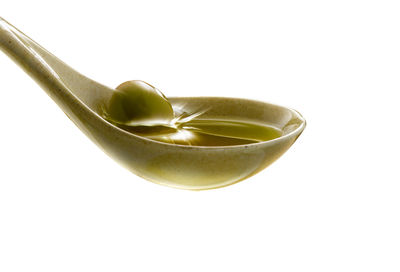 Close-up of drink in bowl against white background