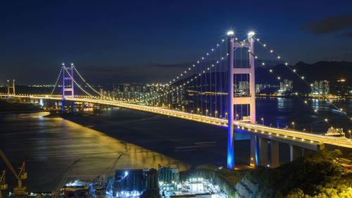 Illuminated suspension bridge at night