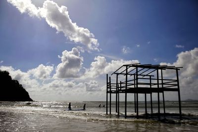View of pier on sea against sky