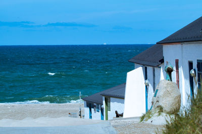 Scenic view of sea against blue sky