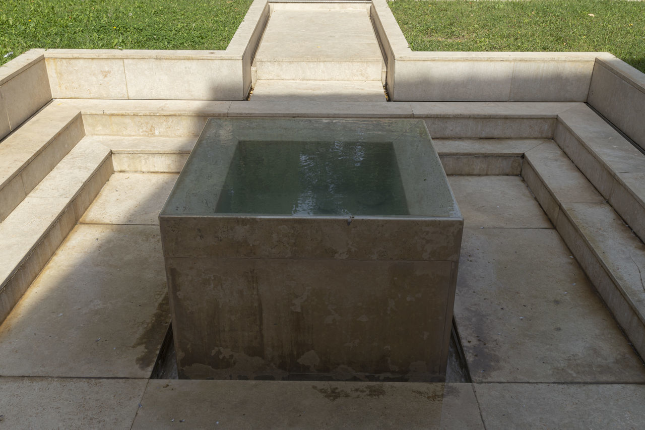 HIGH ANGLE VIEW OF CONCRETE STEPS IN PARK