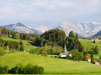 Scenic view of landscape and mountains against sky