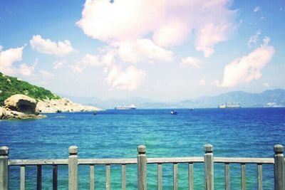 Scenic view of sea against cloudy sky