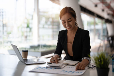 Businesswoman working at office